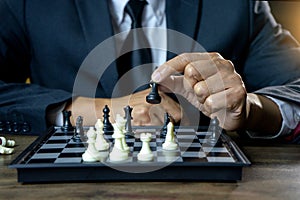 Businessman play chess how to crash overthrow the competitor