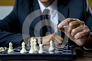 Businessman play chess how  to crash overthrow the competitor