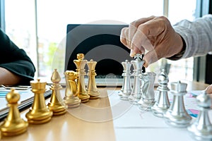 Businessman play chess on the marketing work place