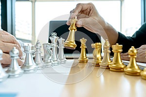 Businessman play chess on the marketing work place