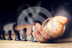 Businessman playing chess board