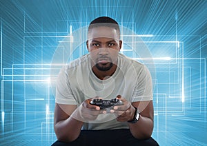 Businessman playing with computer game controller with bright light lines background