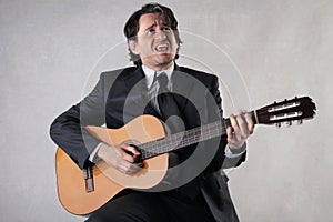 Businessman playing the guitar