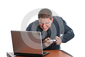 Businessman playing on laptop