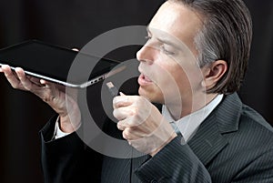 Businessman Plugs In Tablet