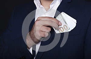 Businessman pocket money in his pocket