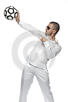 Businessman pointig on the ball, isolated on the white background