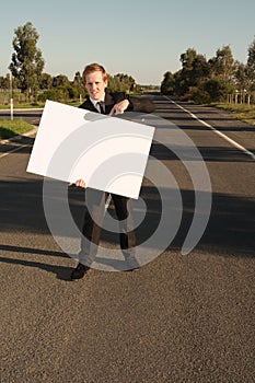 Businessman pointing on billboard