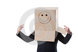 Businessman pointing on box on his head