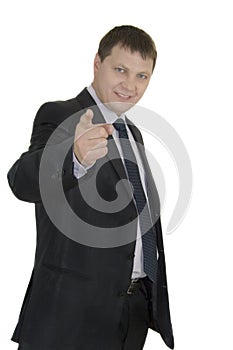 Businessman pointing at copyspace over white