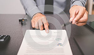 Businessman pointing at documents and sending pens to customers for signatures, document concepts contract agreement, employment,