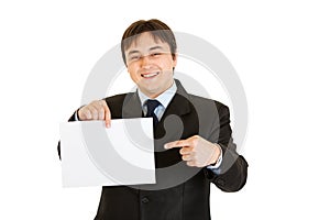 Businessman pointing finger at empty white paper