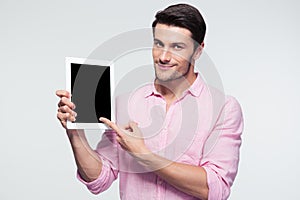 Businessman pointing finger on tablet computer screen