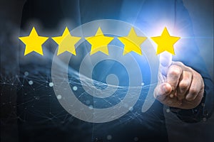 Businessman pointing five star symbol to increase rating of company. Customer satisfaction and product service evaluation concept