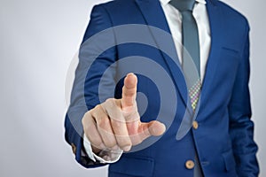 Businessman pointing index finger