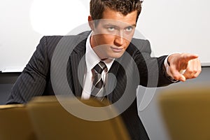 Businessman pointing in office