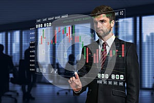 Businessman pointing and presses on virtual screen futuristic interface conenect to big data and show stock graph