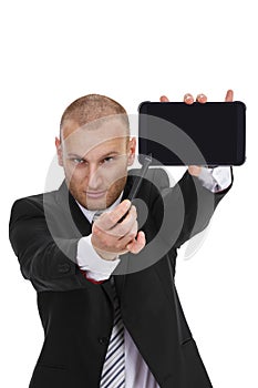 Businessman pointing with a sylus to a tablet phablet phone photo