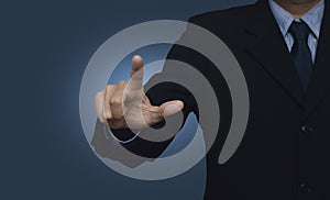 Businessman pointing to something or touching a touch screen on