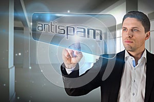 Businessman pointing to word antispam photo