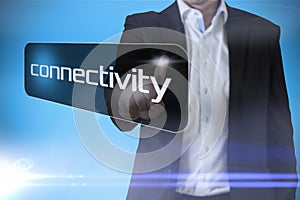 Businessman pointing to word connectivity photo