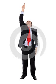 Businessman pointing upwards