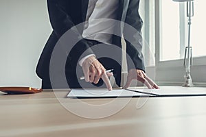 Businessman pointing where to sign a contract