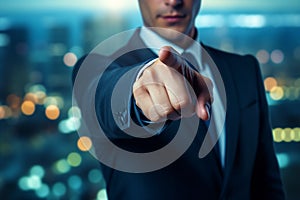 businessman points with outstretched finger