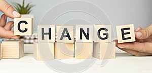 Businessman points to wooden blocks with the word Change to Chance. Personal development. Career growth or change