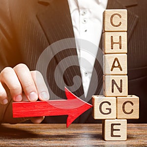 Businessman points to wooden blocks with the word Change to Chance. Personal development. Career growth or change yourself concept