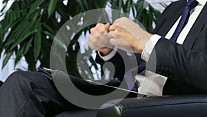 Businessman or politician giving live interview. Body language gesticulation with hands. Close up shot.