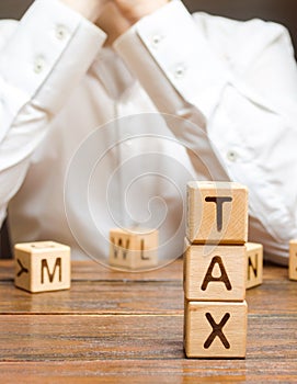 Businessman ponders the process of paying taxes and tax refunds. Tax holidays