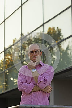 Businessman portrait in front of office building