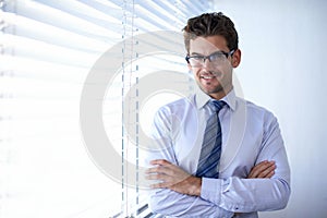 Businessman, portrait and happy with arms crossed at workplace for professional career in finance, confidence and pride