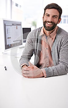 Businessman, portrait and happy at desk in modern office, professional and career pride in company. Accountant, face or