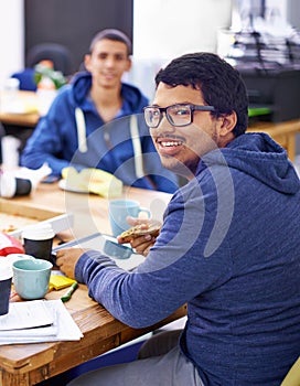 Businessman, portrait and lunch by desk in office with happiness for eating break, pizza and coworking company