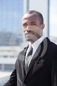 Businessman portrait on skyscrapers background