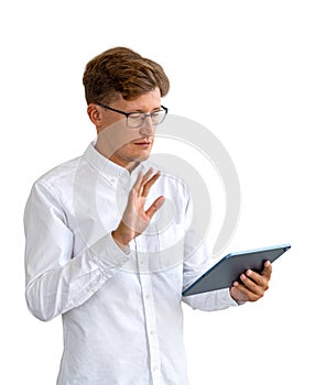 Businessman portrait waves hand to tablet screen, isolated over white background