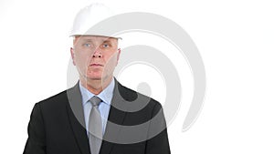 Businessman portrait wearing helmet looking calm and waiting reporter interview