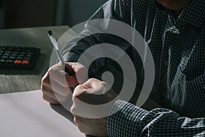 Businessman pounding fist on table, cropped image. Angry businessman showing his fists. Frustrated businessman hand clenched fists