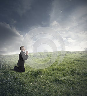 Businessman praying