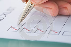 Businessman preparing checklist photo