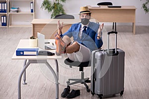 Businessman preparing for trip during pandemic