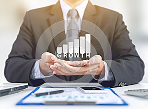 Businessman present graph with growth