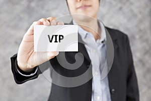 businessman presenting business card with word VIP