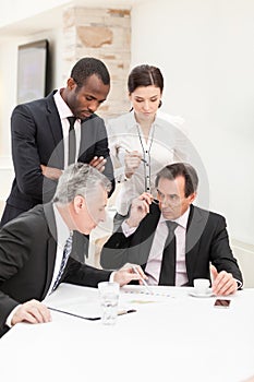 Businessman presenting ideas to his business team