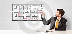 Businessman presenting maze