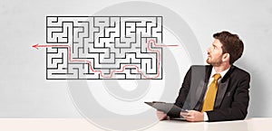 Businessman presenting maze