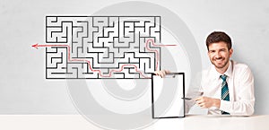 Businessman presenting maze