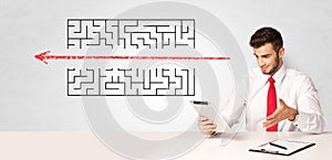 Businessman presenting maze